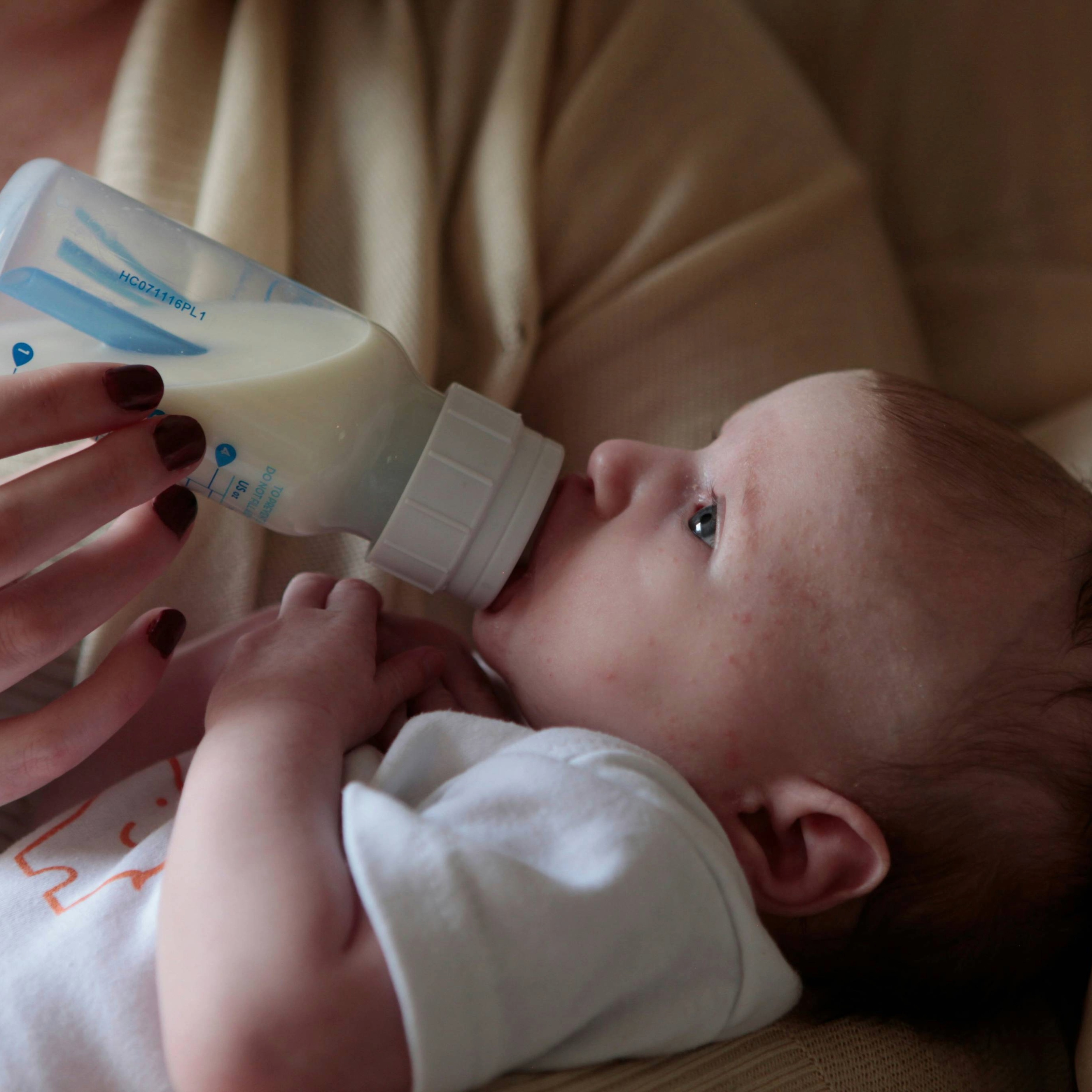 Picture of a baby feeding from a bottle